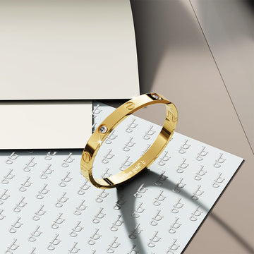 Carrie Stainless Steel Bangle in Gold - 64mm