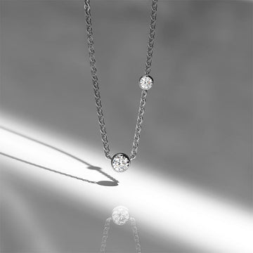 Asymmetrical Diamond Elegance Necklace Encased in 18k White Gold