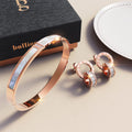 Boxed Modest Hinged Bangle & Round Interlock Earrings Set in Rose Gold